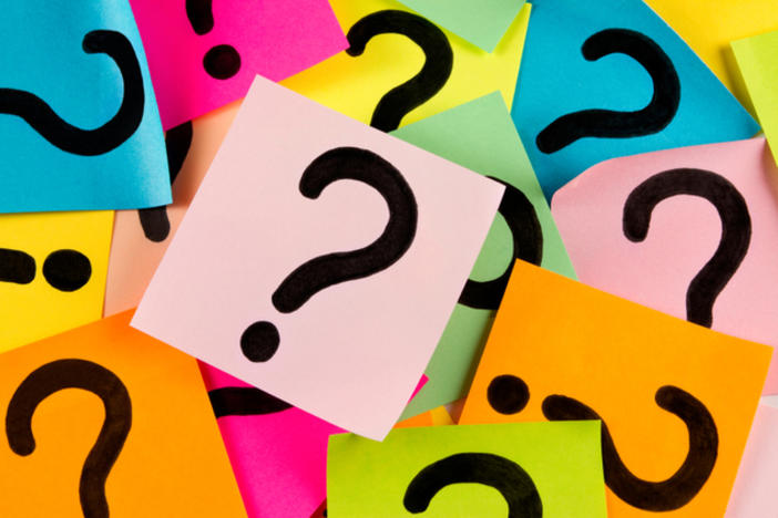 question marks on multi-colored post-its